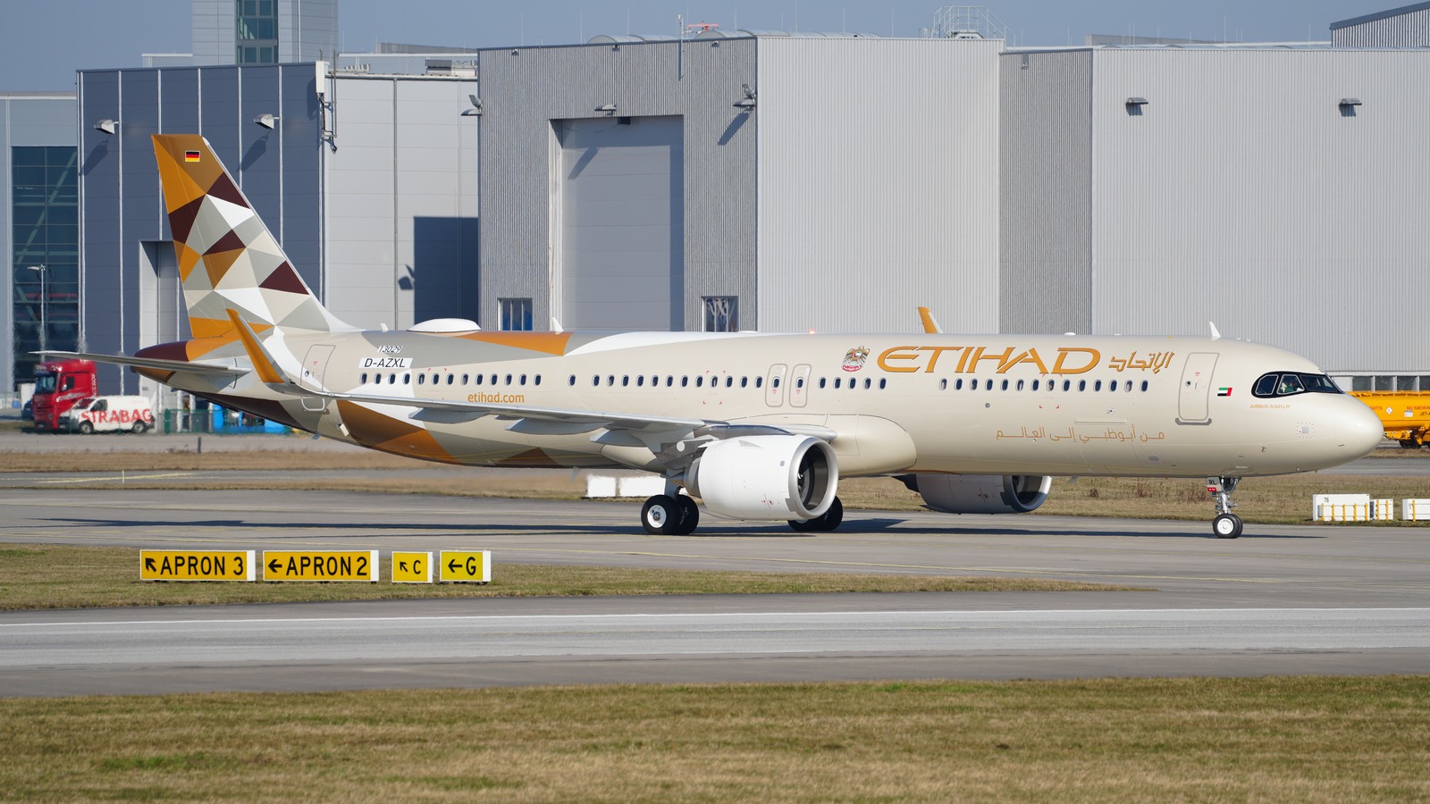 Etihad Airways Airbus A321LR aircraft in Etihad livery on an airport apron