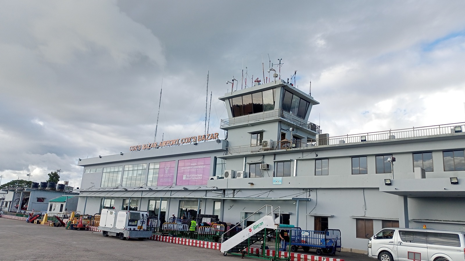 Existing Cox's Bazar Airport terminal and control tower seen from the apron in July 2024