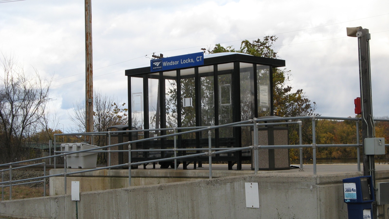 Amtrak Windsor Locks CT glass shelter and high platform south of Interstate 91, the stop being replaced on October 18, 2026