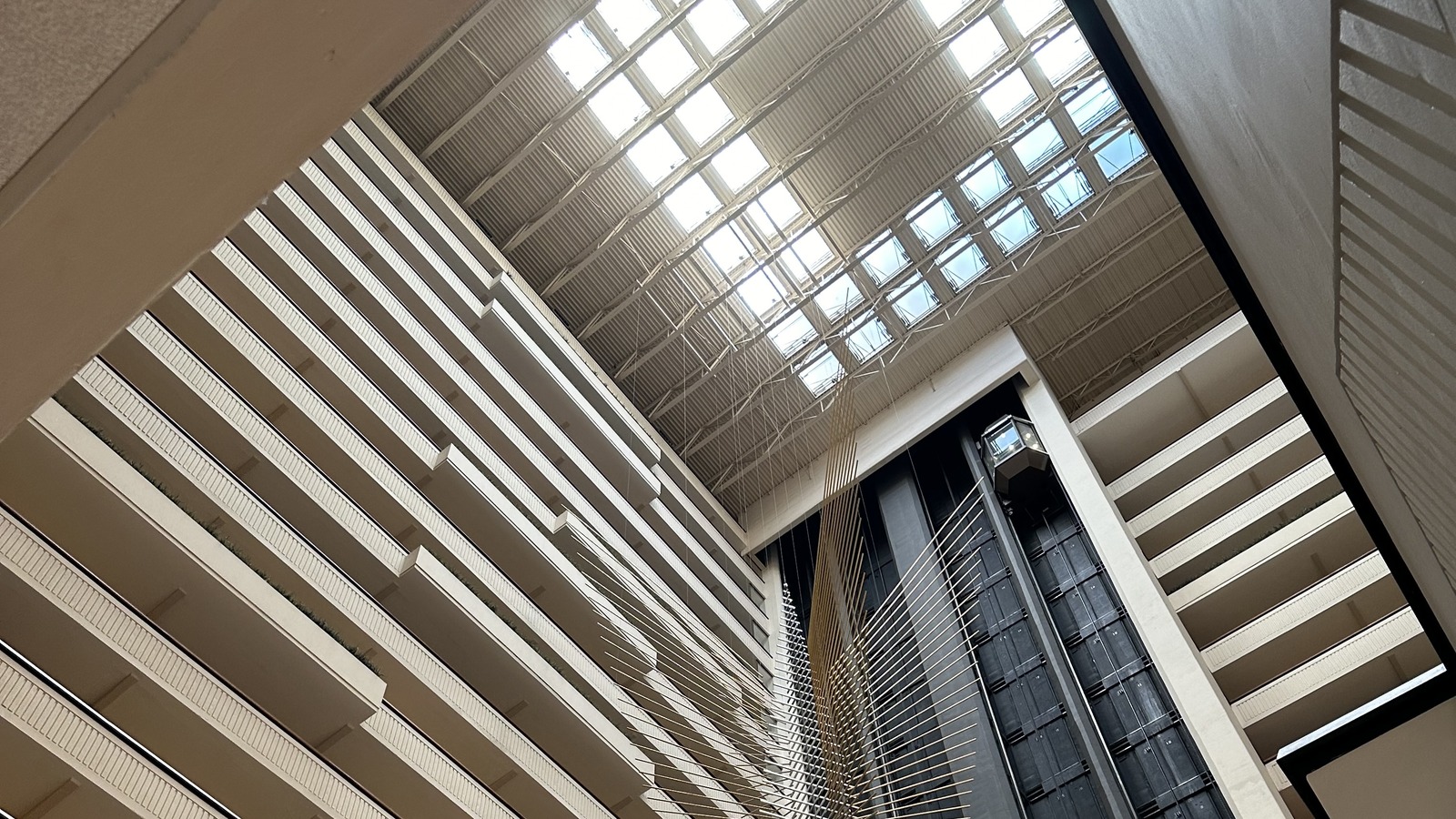 Hyatt Regency Milwaukee lobby atrium with skylight and glass elevators, photographed February 9, 2024; general Hyatt property context