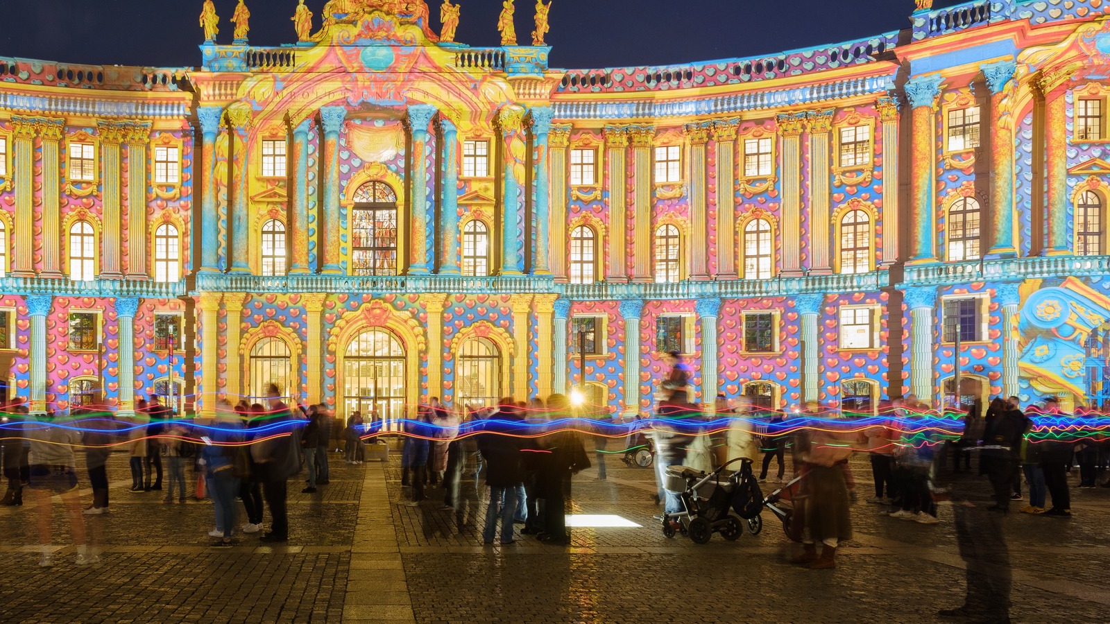 Bebelplatz in Berlin glowing with colorful Festival of Lights projections at night