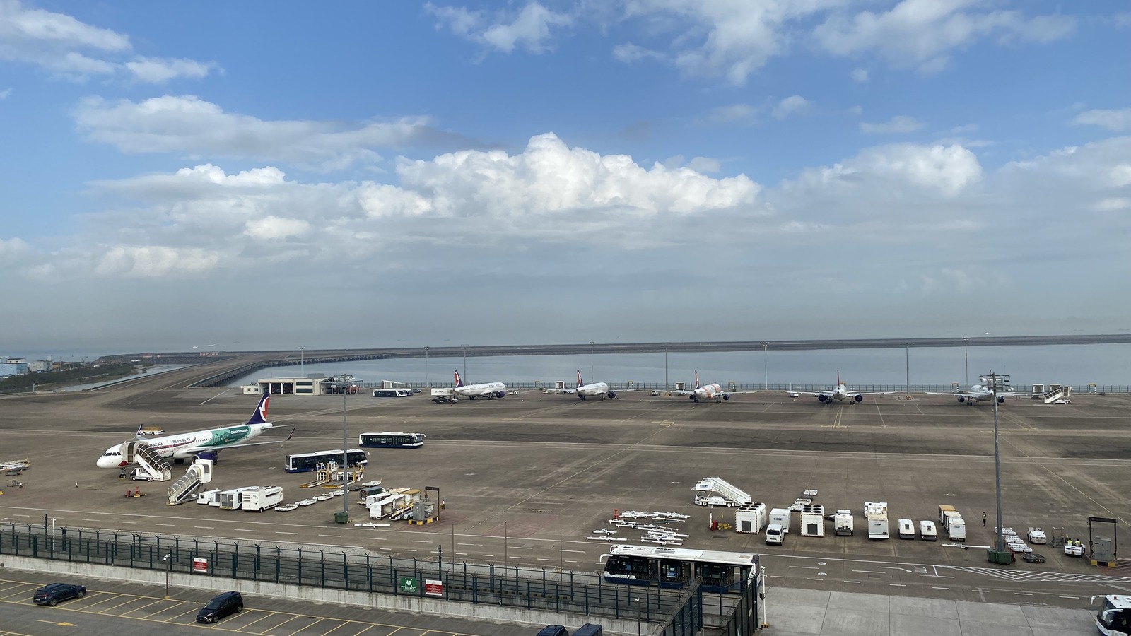 Aircraft and apron at Macau International Airport viewed from the airport station on February 18, 2023