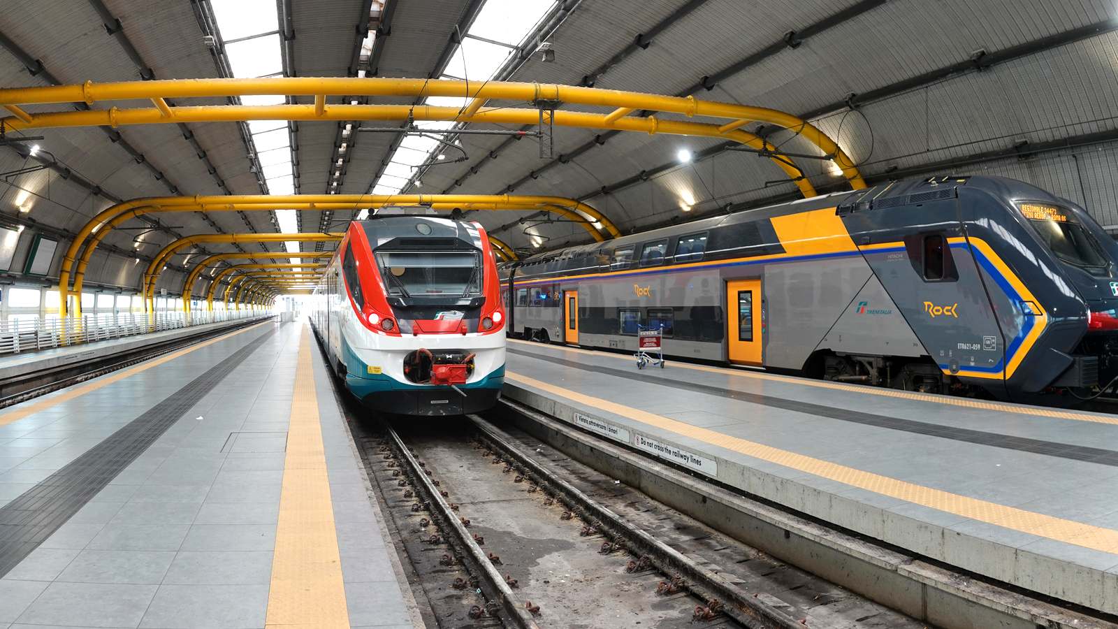 Leonardo Express train at a platform of Fiumicino Aeroporto railway station beside a regional train