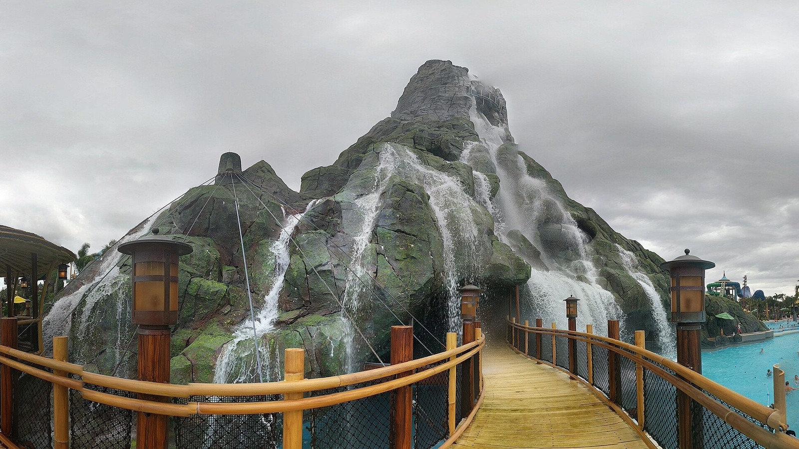 The Krakatau volcano and its waterfalls beside a wooden bridge at Universal's Volcano Bay water park in Orlando