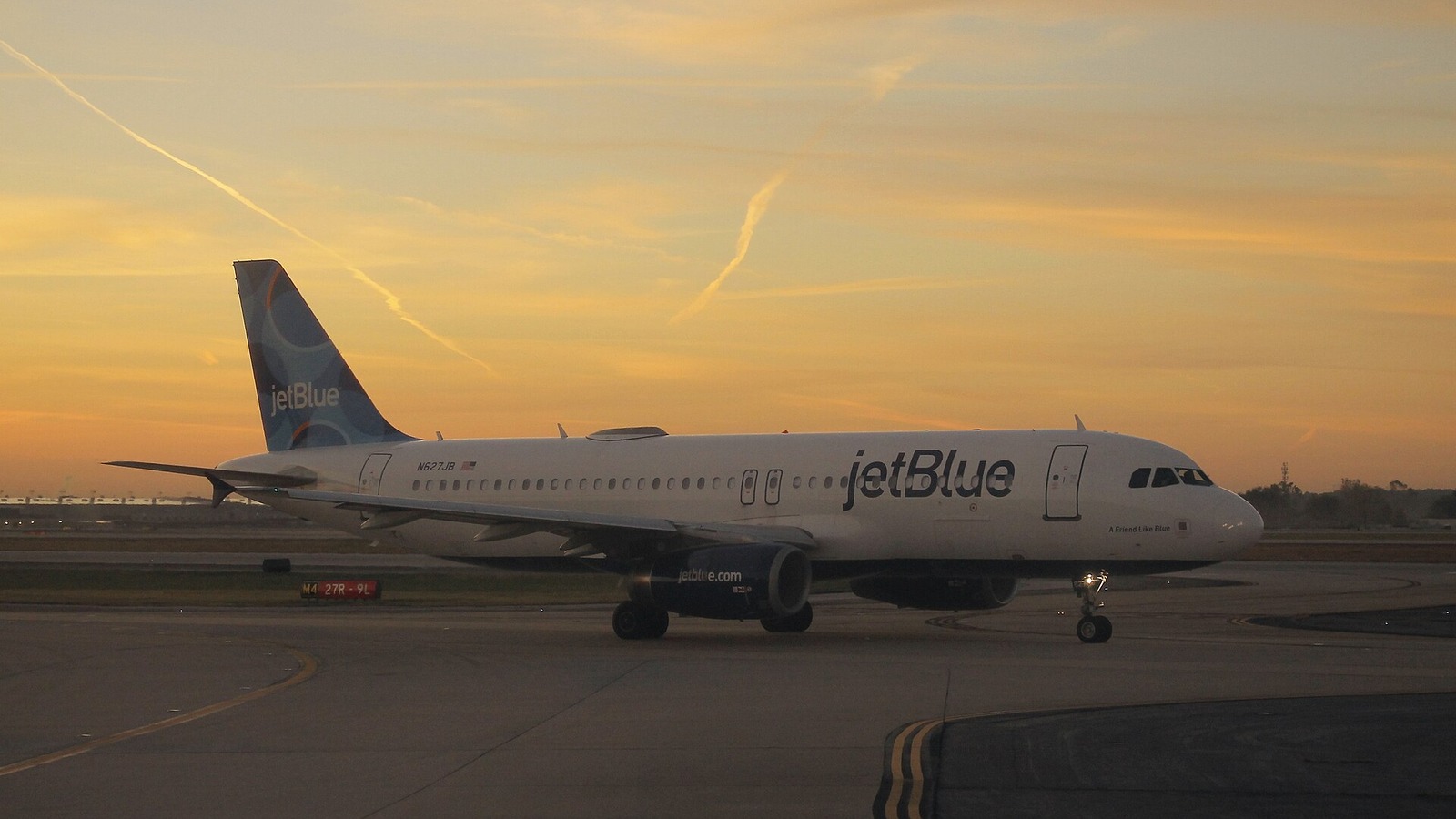 A JetBlue Airbus A320 taxiing at Atlanta at sunset in an October 2022 file photo
