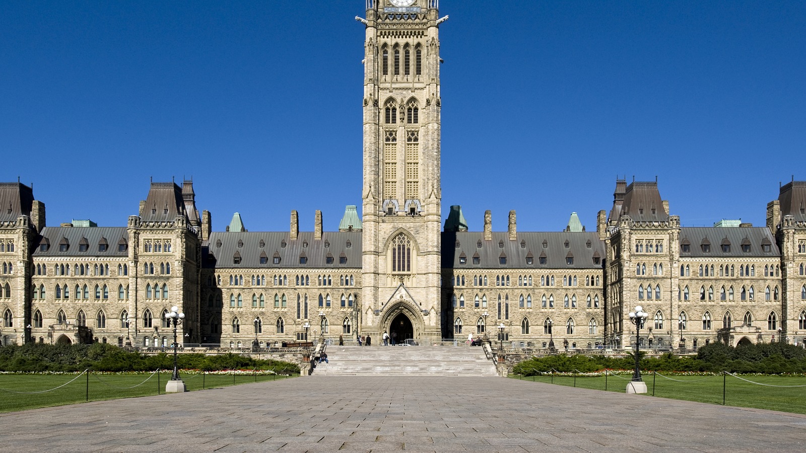Centre Block and Peace Tower on Parliament Hill in Ottawa under a clear blue sky