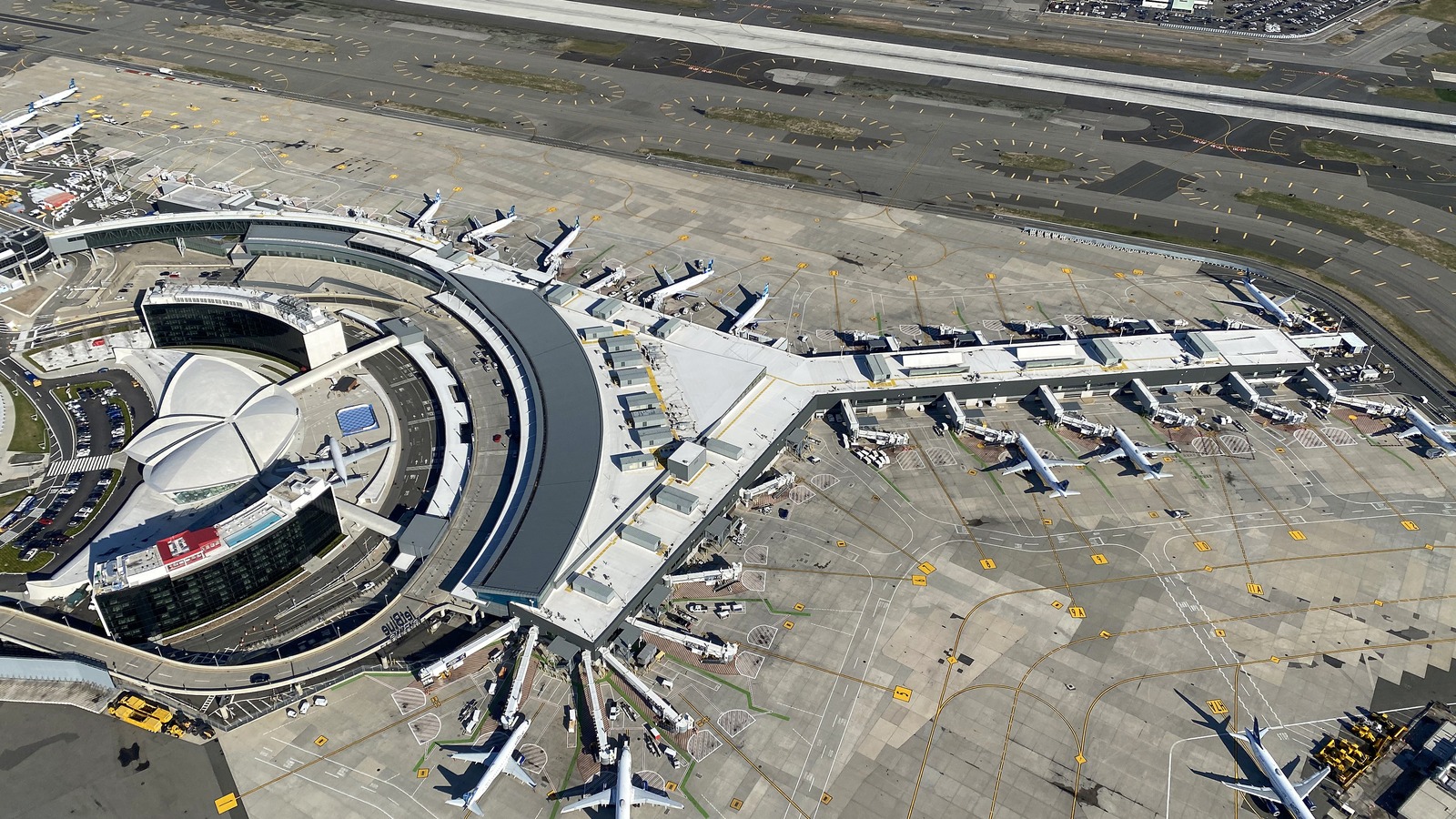 Aerial view of Terminal 5 at John F. Kennedy International Airport with aircraft parked at gates
