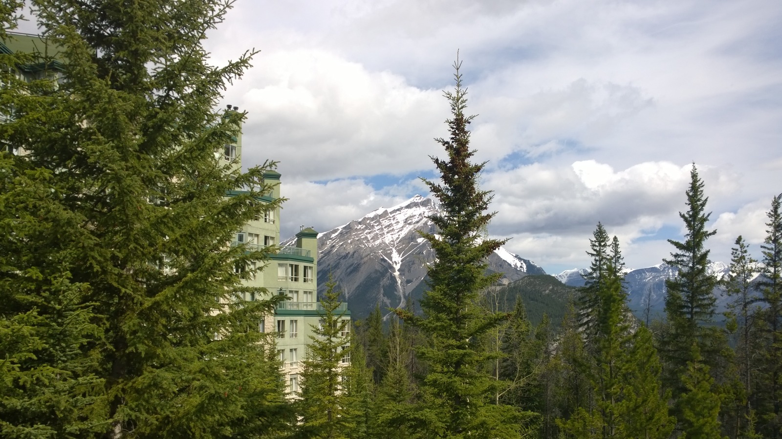 Rimrock Resort Hotel exterior in Banff with mountain backdrop