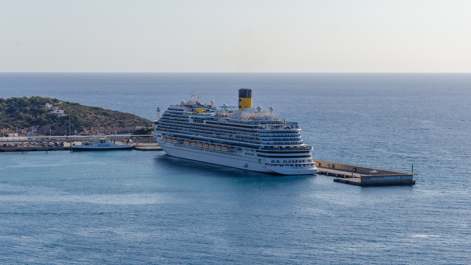 The cruise ship now sailing as Carnival Firenze, photographed as Costa Firenze docked at Ibiza in 2021 before its 2024 transfer to Carnival