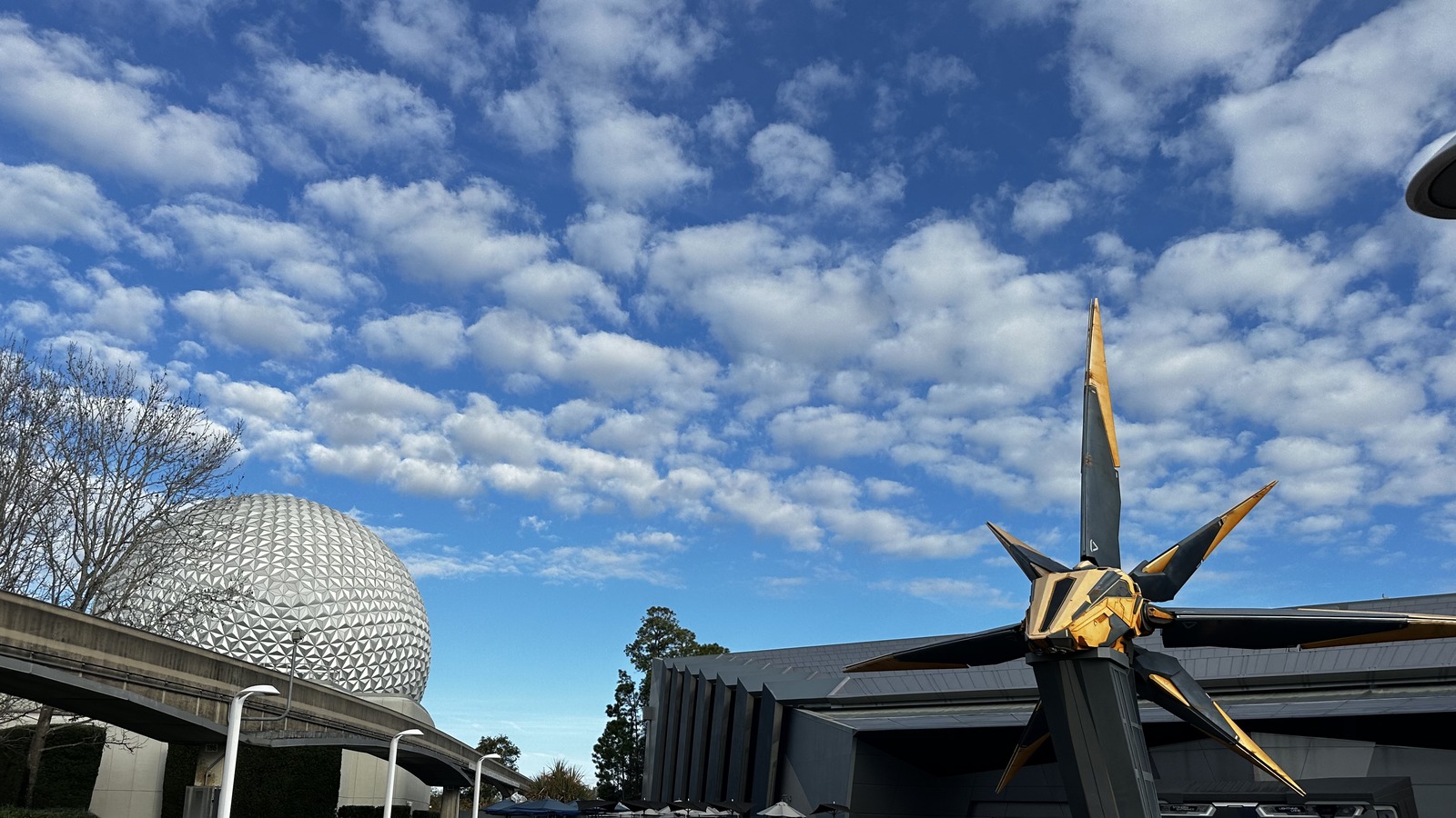 Wonders of Xandar pavilion and Milano sculpture for Guardians of the Galaxy Cosmic Rewind at EPCOT, with Spaceship Earth in the distance