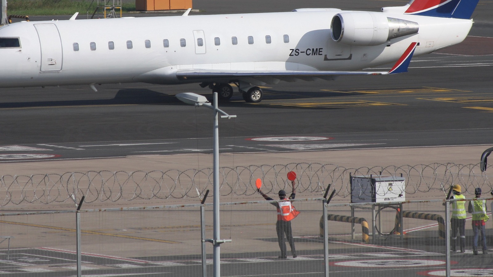 CemAir CRJ-100ER regional jet ZS-CME on an airport ramp in daylight