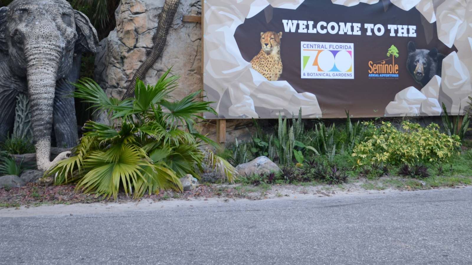 Welcome sign and elephant statue at the road entrance to the Central Florida Zoo in Sanford