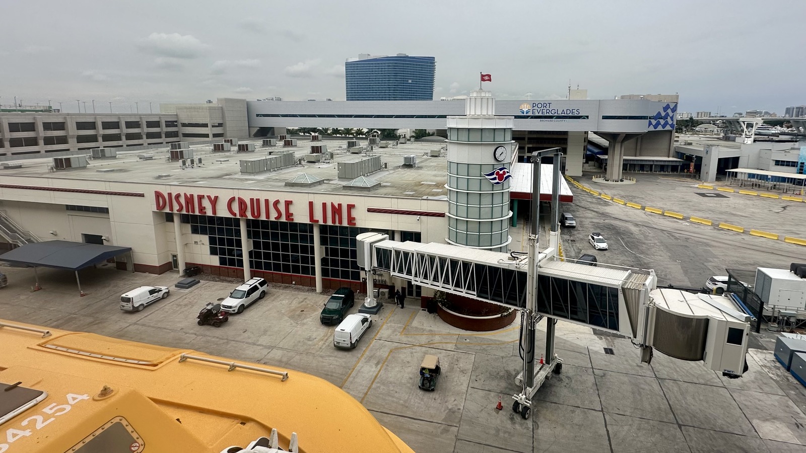 Disney Cruise Line Terminal 4 at Port Everglades in Fort Lauderdale, with the Disney Cruise Line sign, Port Everglades skybridge, and a gangway at the berth