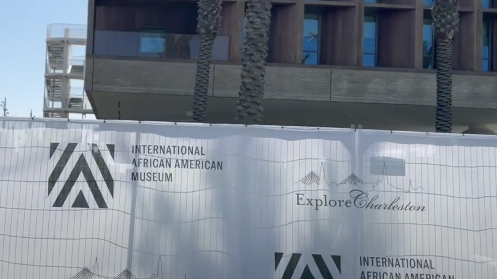 International African American Museum exterior and promotional fencing in Charleston in 2023; historical venue view, not They Lived exhibition