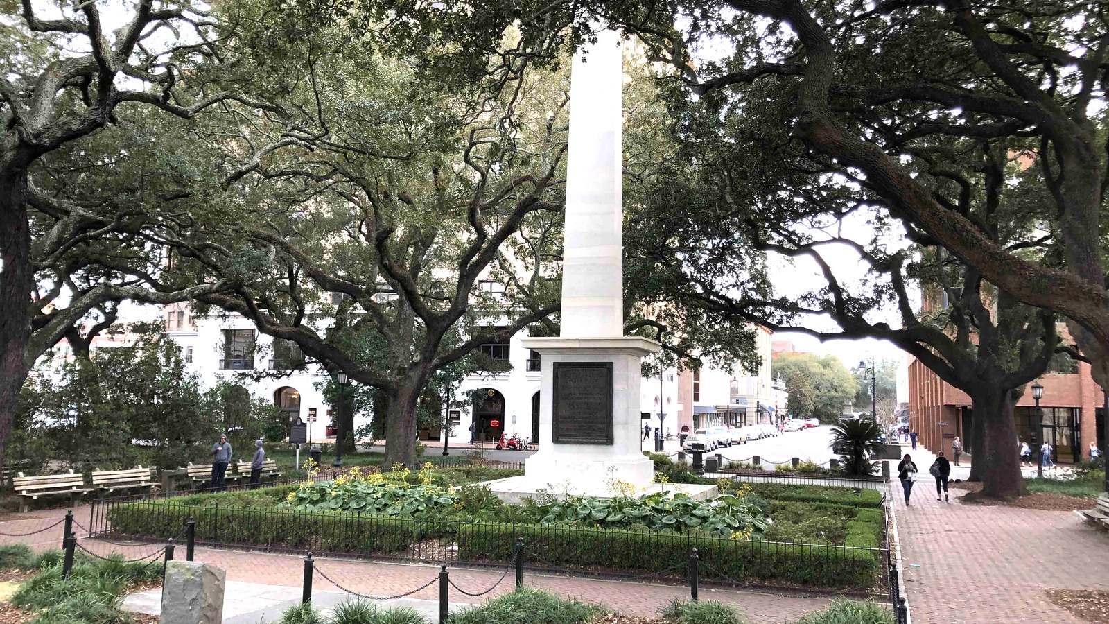 Johnson Square in Savannah Historic District, with the Nathaniel Greene monument under live oaks, on the square facing Recess Hotel at 7 E. Congress Street.