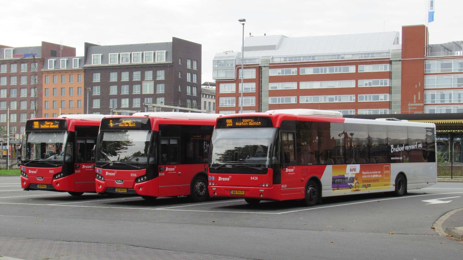 Three red Arriva regional buses parked at the bus station in s-Hertogenbosch