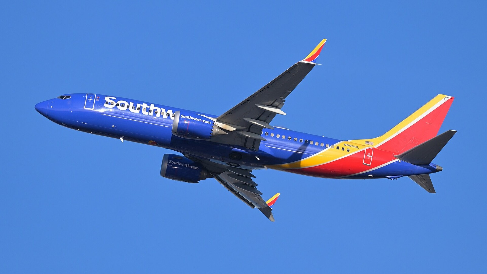 Southwest Airlines Boeing 737 MAX 8 climbing after takeoff against a blue sky