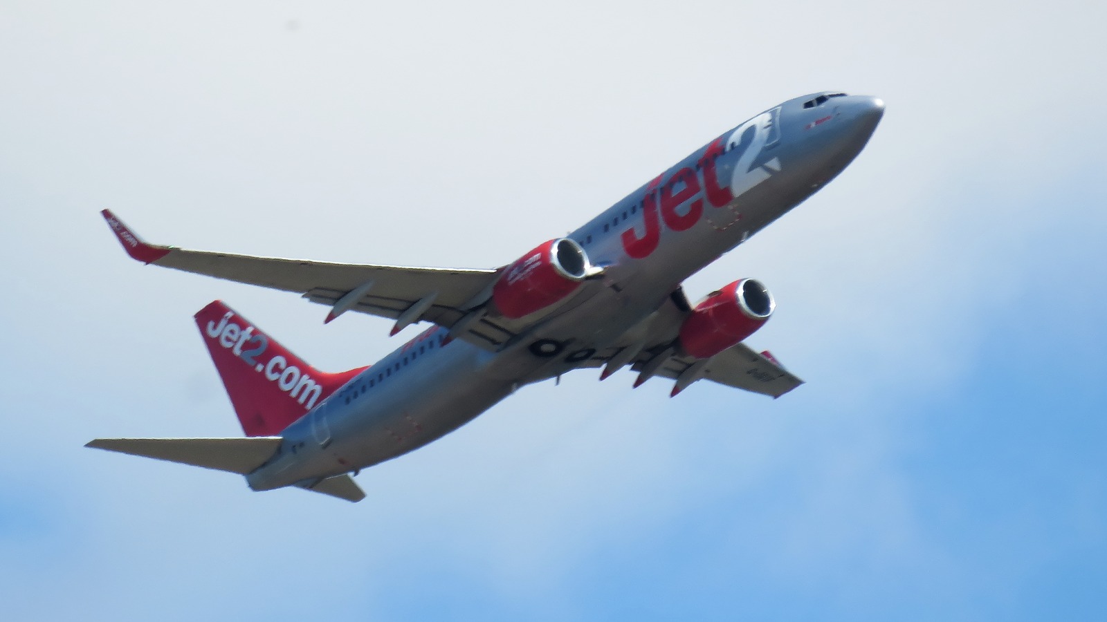 Jet2 Boeing 737-800 in flight showing red and silver Jet2 livery