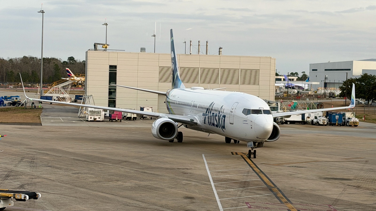 Alaska Airlines Boeing 737-900ER N408AS taxiing on the ramp with the Alaska wordmark visible on the fuselage