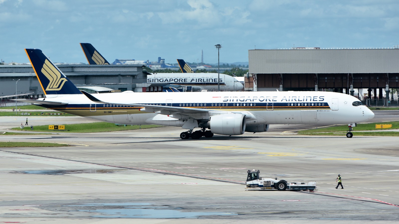 Singapore Airlines Airbus A350 900 aircraft 9V SMK taxiing at Singapore Changi Airport in daylight