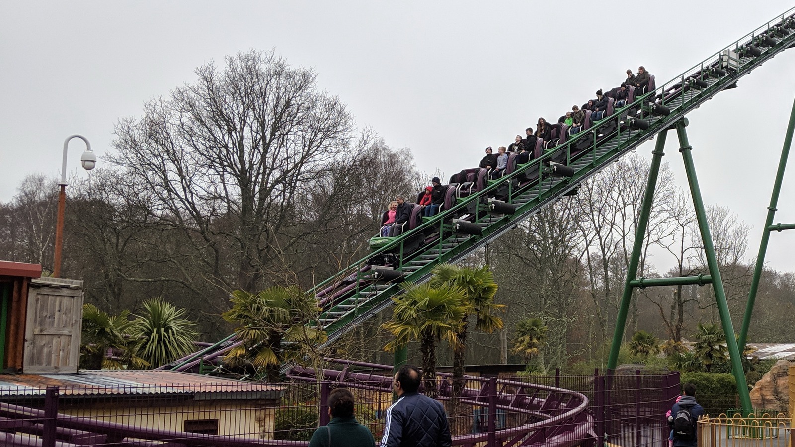 The Velociraptor roller coaster climbs its lift hill at Paultons Park in Hampshire with riders aboard.