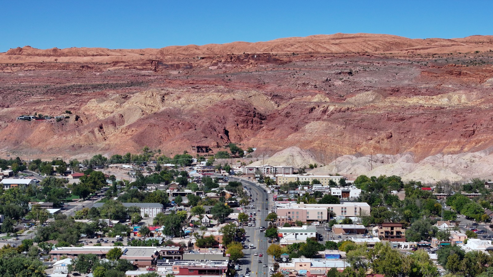 Downtown Moab and U.S. Highway 191 beneath red rock cliffs on October 1, 2025, before the wind advisory