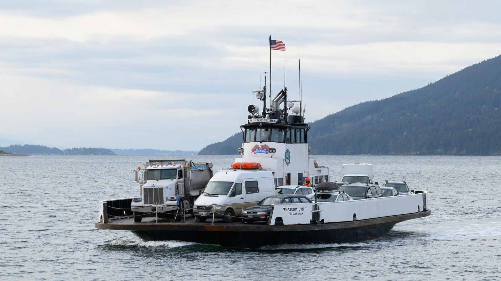 Whatcom Chief ferry carrying vehicles across the water toward Lummi Island in daylight