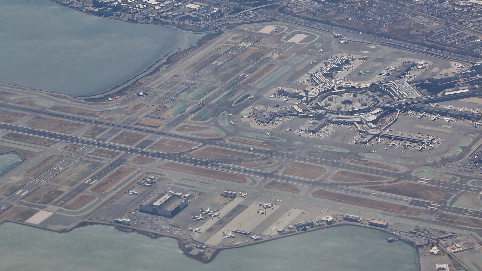 Aerial view of San Francisco International Airport terminals and runways from the east in September 2026