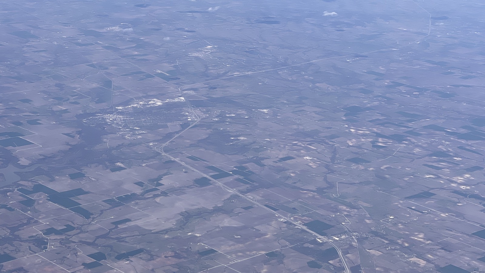 Daytime aerial view of Interstate 35 through Texas fields near Hillsboro, showing the highway corridor