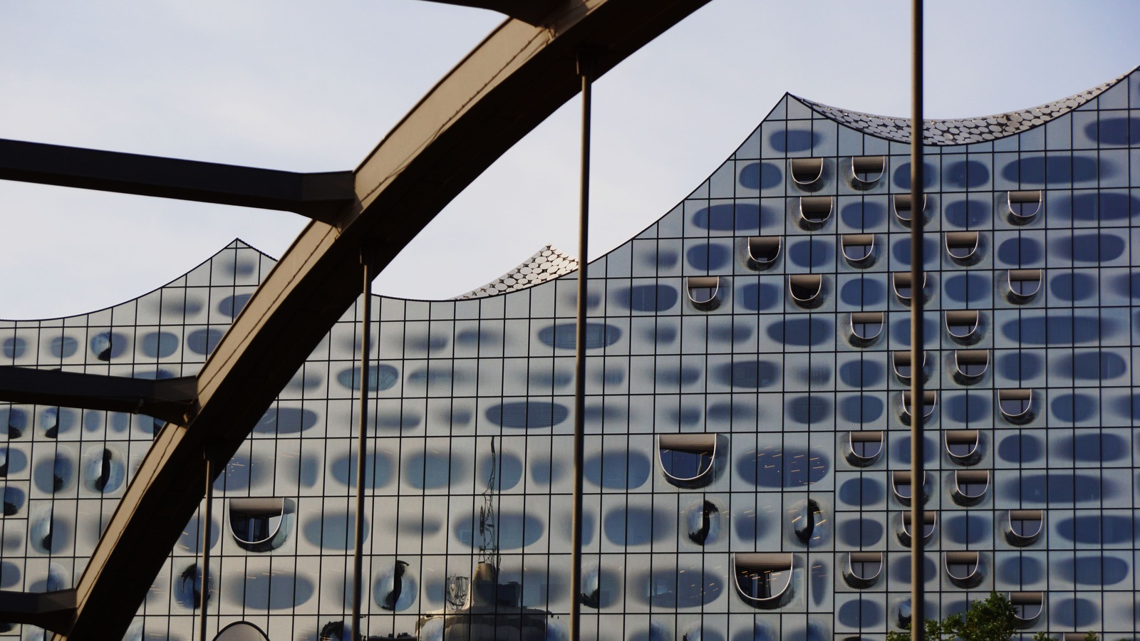 The glass facade and curved roofline of Hamburg's Elbphilharmonie photographed in July 2023.