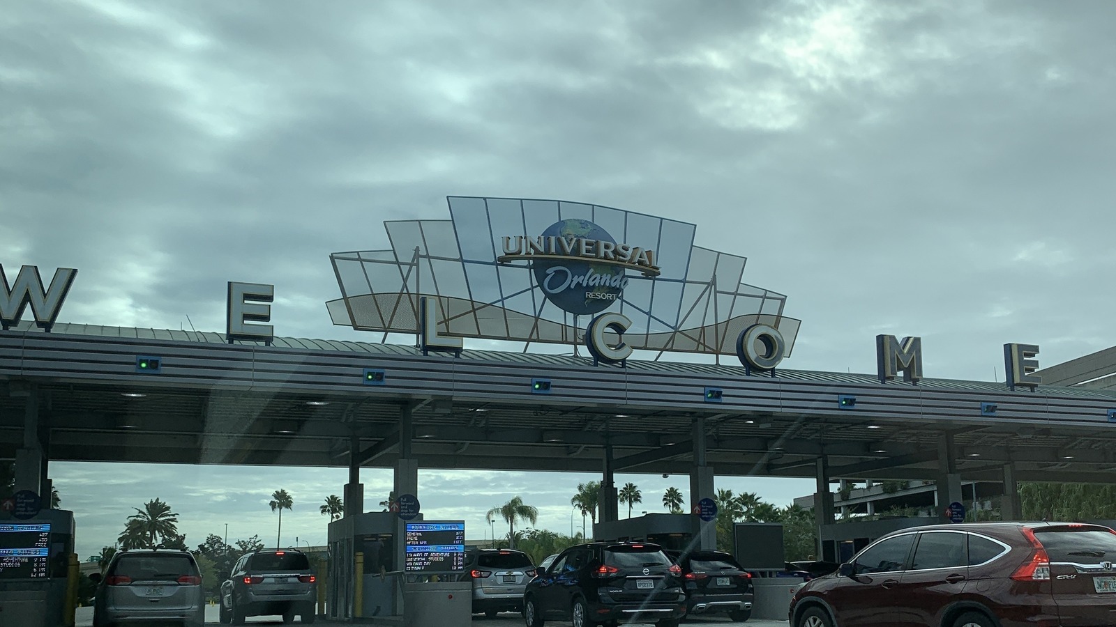 Welcome arch at the Universal Orlando Resort entrance on a clear day