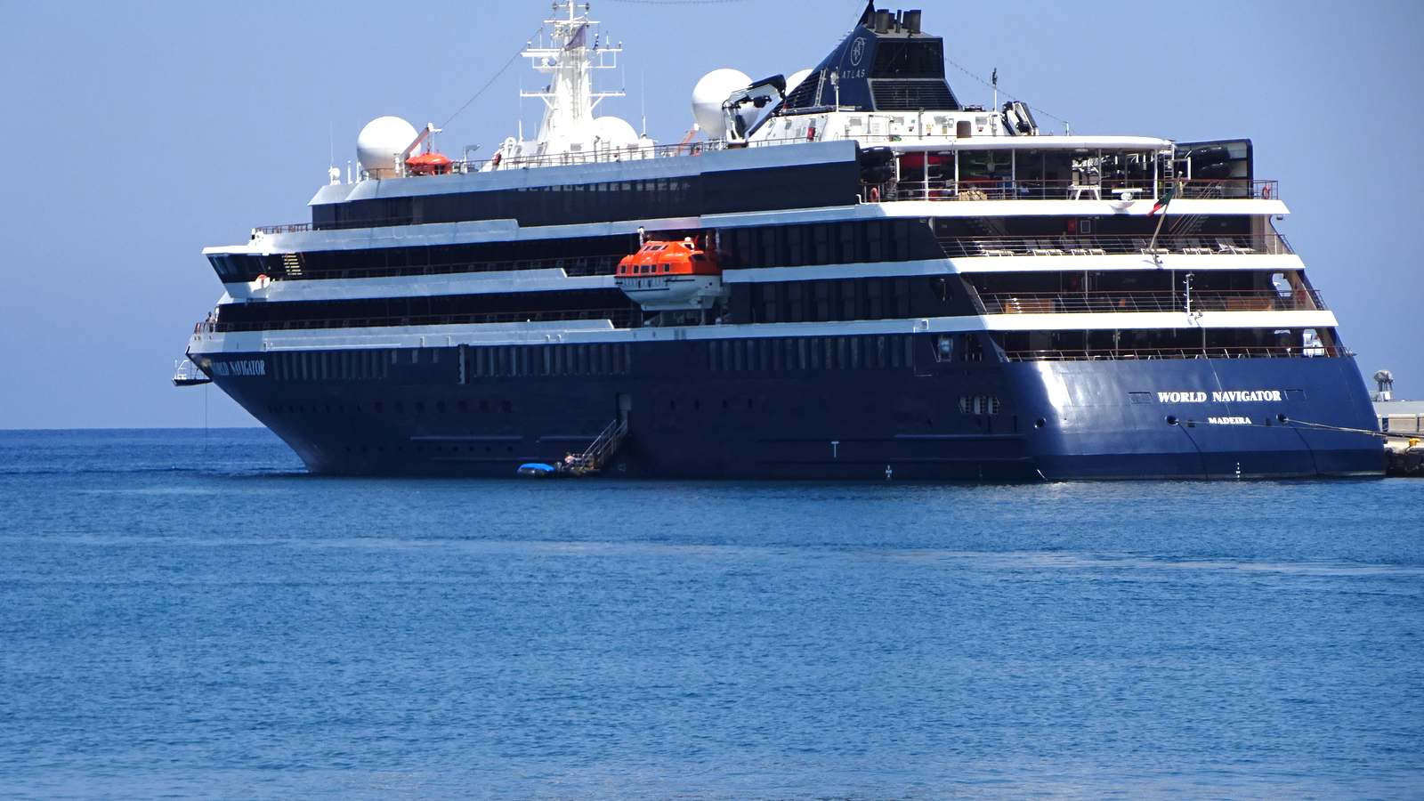 Atlas Ocean Voyages expedition ship World Navigator moored in the Port of Rhodes under a blue sky