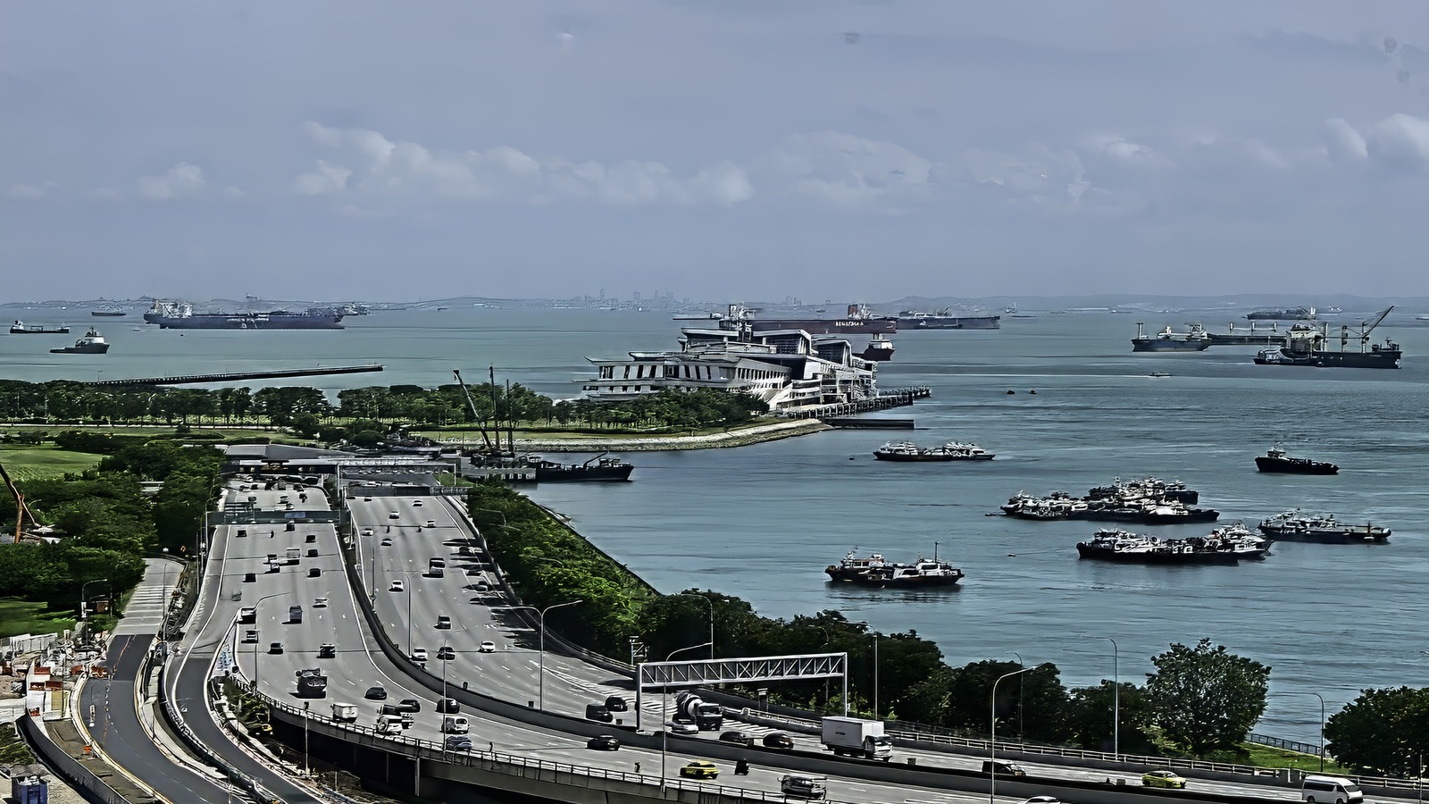 Daytime exterior view of the Marina Bay Cruise Centre Singapore terminal building seen across the water