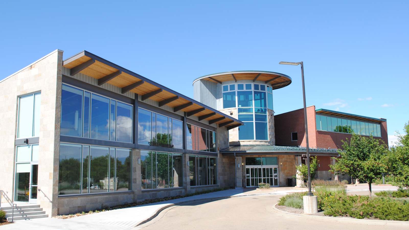 The Longmont Museum's stone and glass entrance on Quail Road in Longmont, Colorado, in an earlier photograph taken before the new galleries opened.