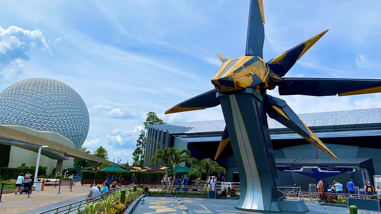 Guardians of the Galaxy: Cosmic Rewind entrance sign at EPCOT with Spaceship Earth in the background