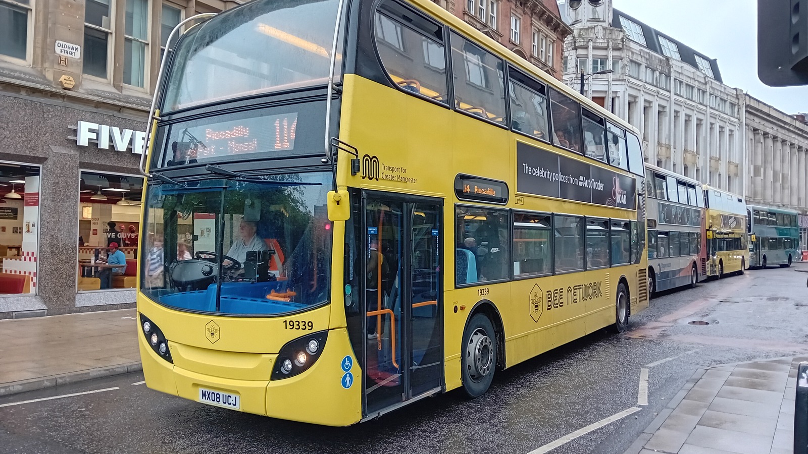 Yellow Bee Network double decker bus in Manchester in daylight