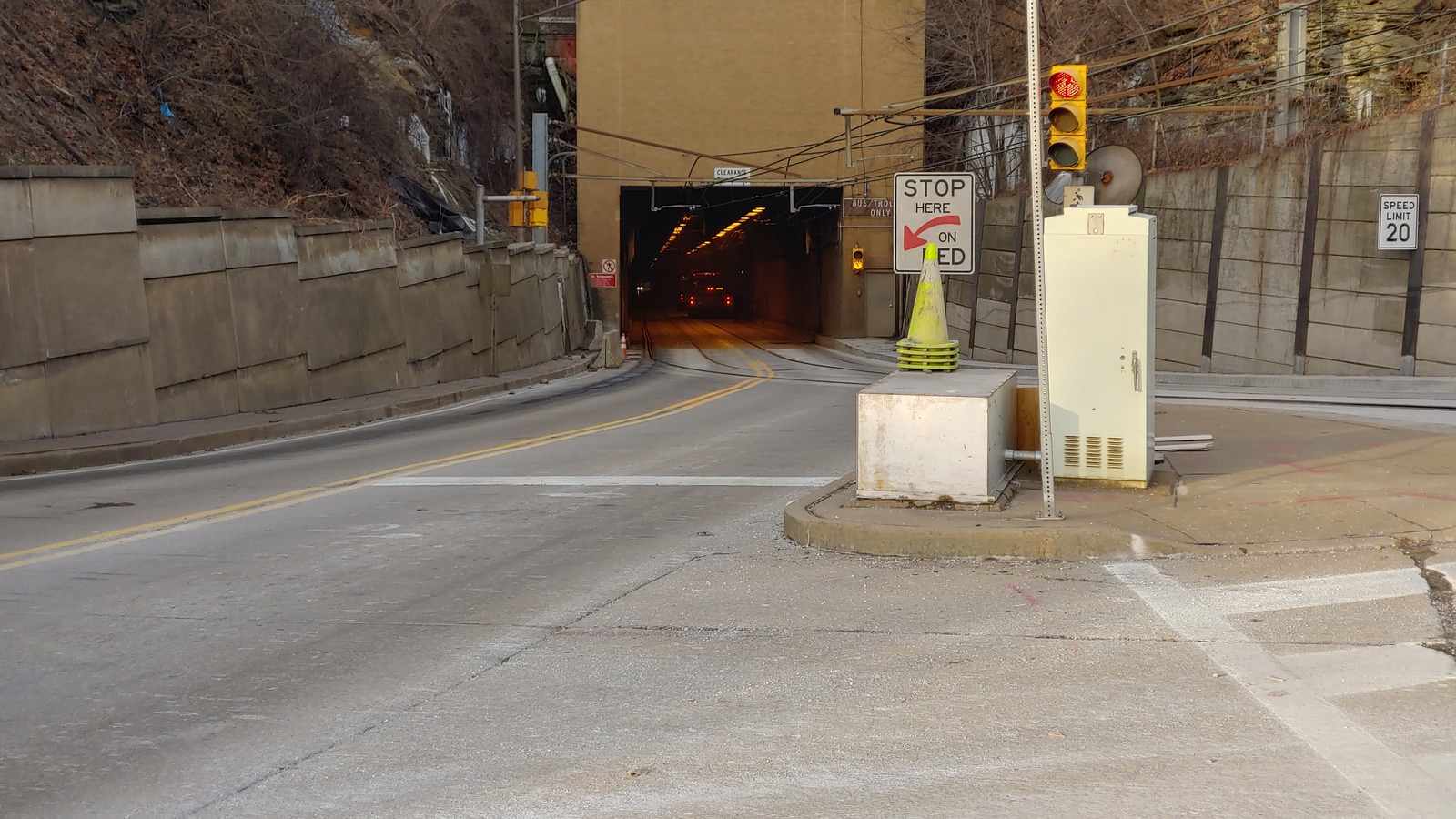 South portal of the Mount Washington Transit Tunnel in Pittsburgh with a traffic signal and bus and trolley only approach