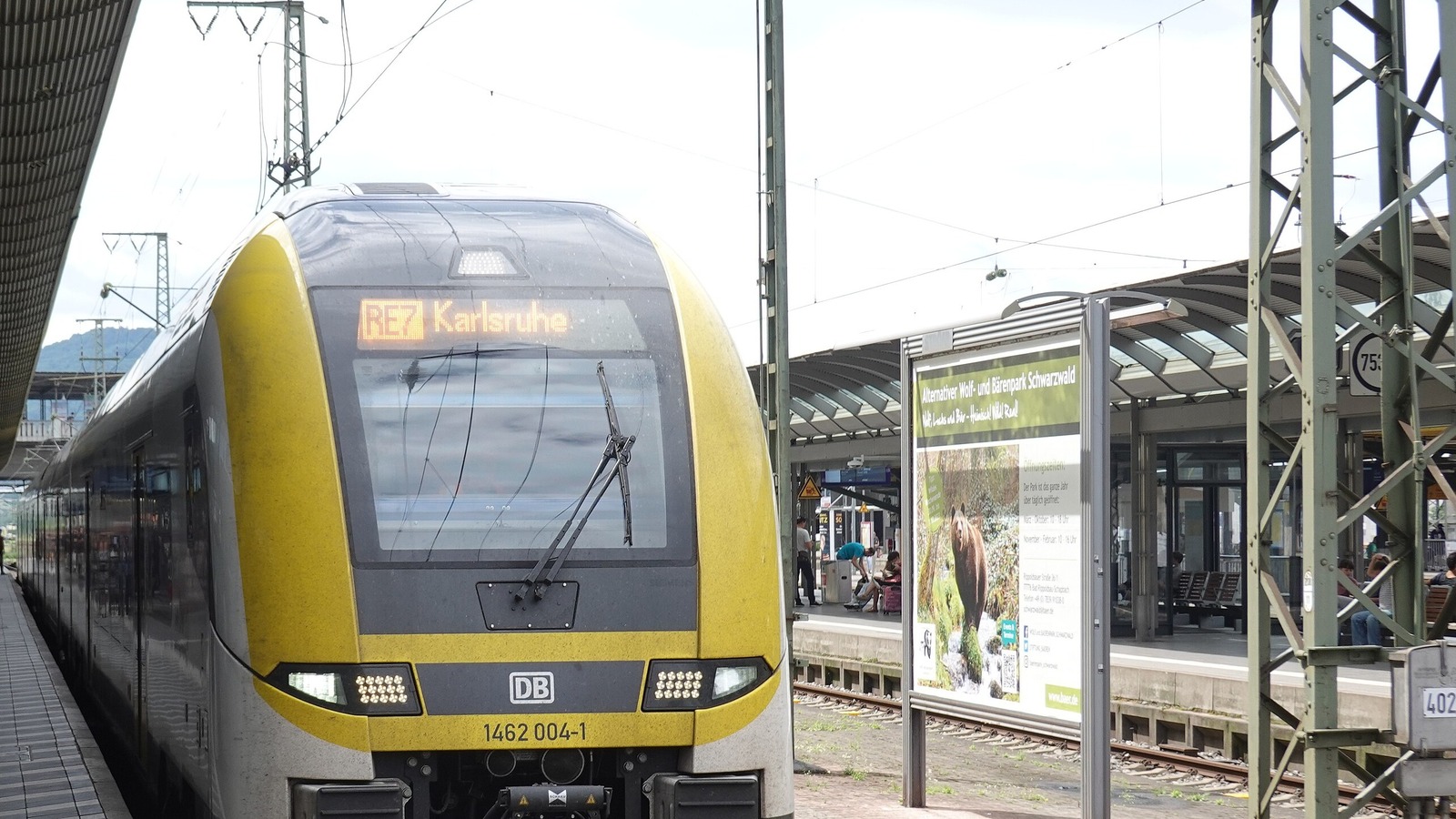 DB regional train marked RE 7 Karlsruhe waiting at a Freiburg station platform