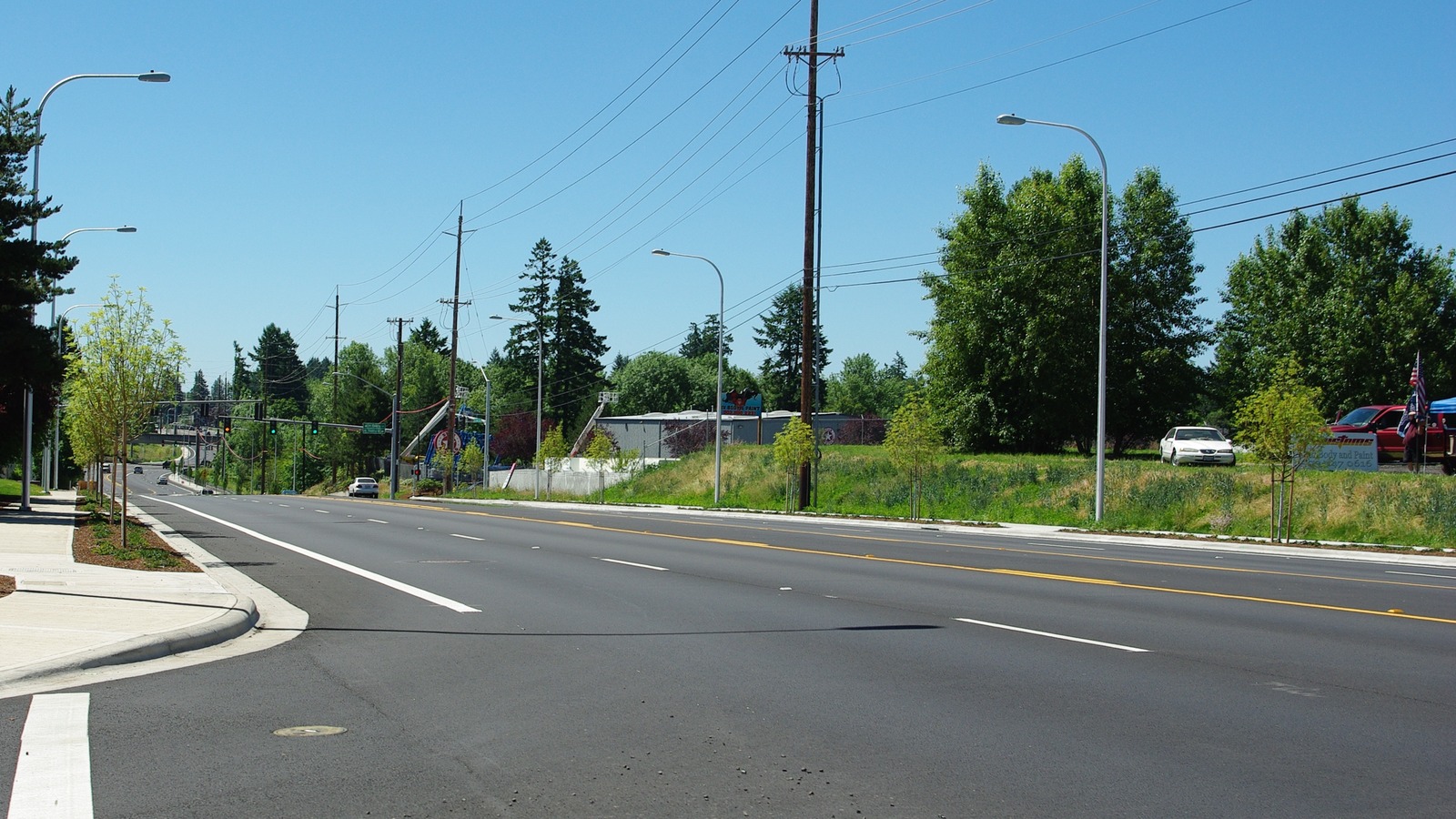 Cornelius Pass Road looking west at Nicholas in Hillsboro, Oregon, under a clear sky.