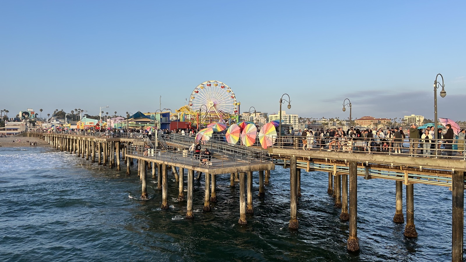 File photo of visitors on the Santa Monica Pier with the Pacific Park Ferris wheel in Southern California, taken in June 2026