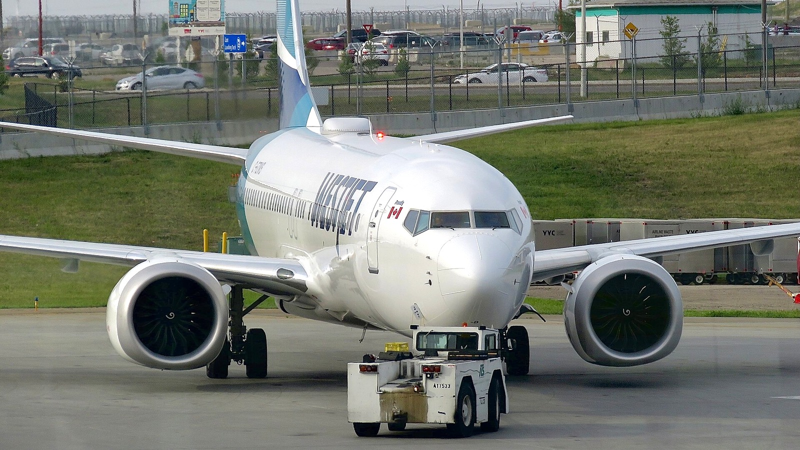 WestJet Boeing 737 MAX 8 being pushed back at an airport apron