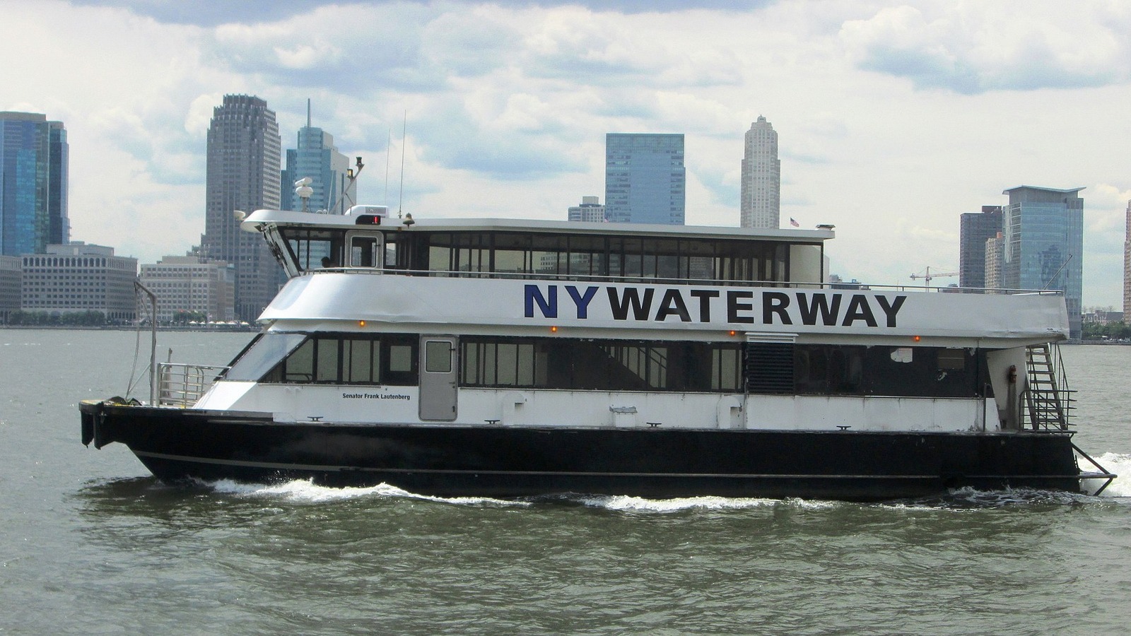 A NY Waterway ferry crossing the Hudson River with the Jersey City skyline behind it in a file photo