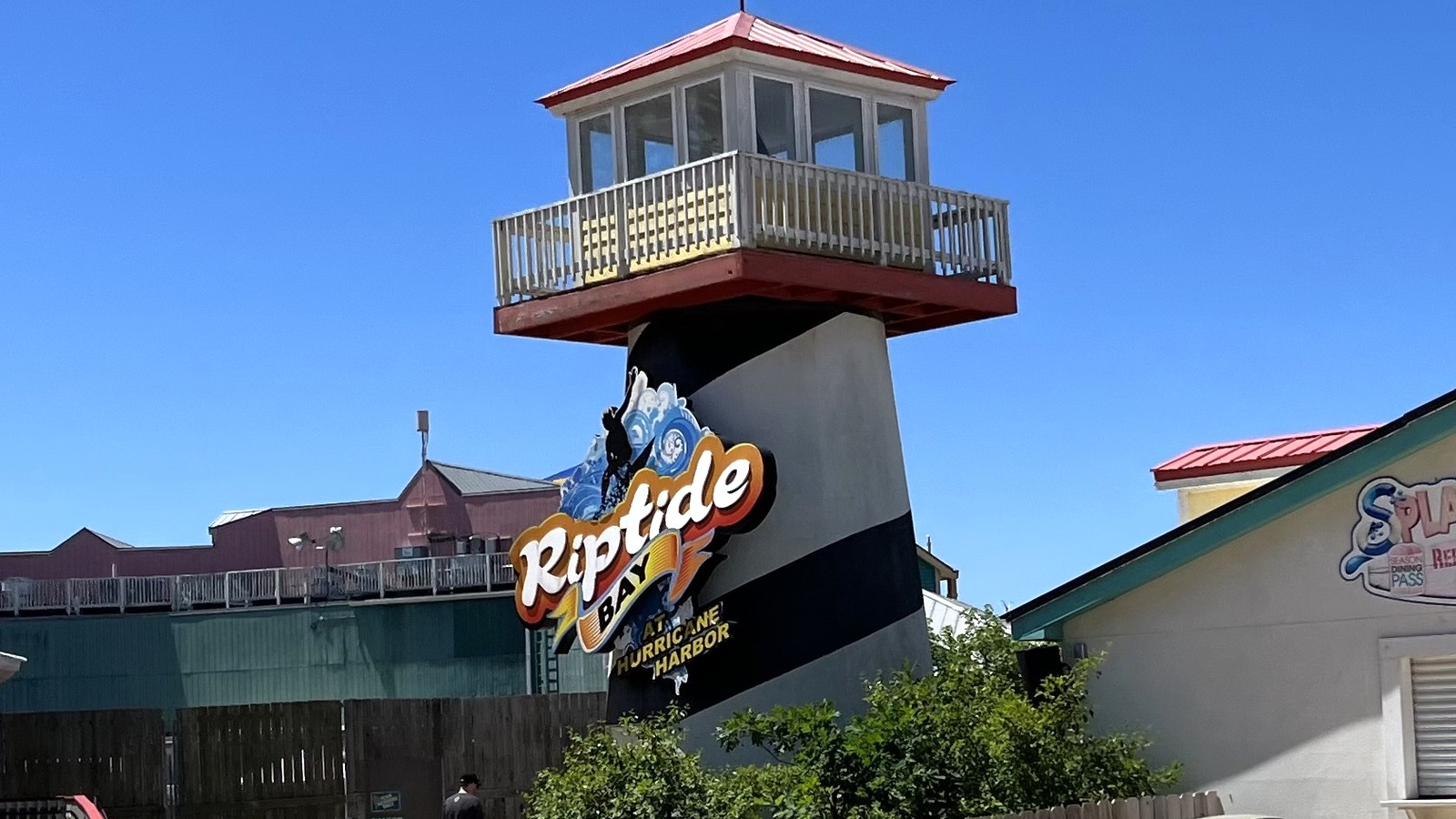 Riptide Bay entrance sign and slide tower at Hurricane Harbor Chicago