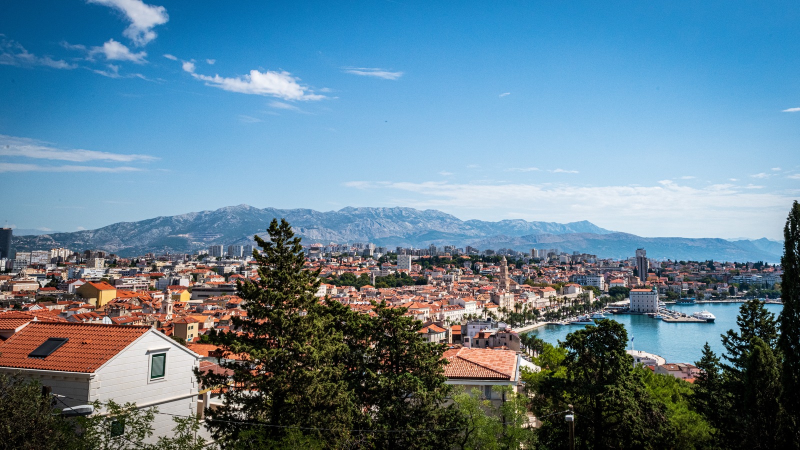 Split skyline and coastline seen from above in 2022